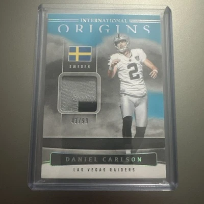 2025 Panini Origins Daniel Carlson International Patch Blue /99 Raiders - Image 1 of 4