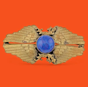 Antiguo broche de latón con alas de querubín Art Nouveau de principios de 1900 cabina de vidrio azul B4 - Imagen 1 de 8