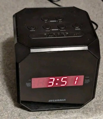 Sylvania SCR1420-BLACK Cube Alarm Clock Radio, Am/FM, 12hr Clock, W/Snooze - Image 1 of 4