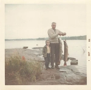 Vintage 1960s Color Photo Man and Child Fishing Holding Large Fish - Picture 1 of 2