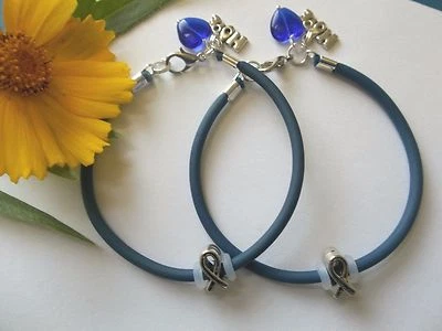 2- PULSERAS DE CONCIENTIZACIÓN SOBRE EL CÁNCER DE COLON CON CINTA/DIJES DE ESPERANZA/CORAZÓN Foto 1 de 3