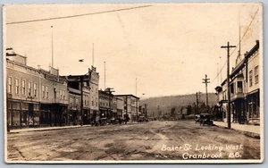 Postcard RPPC c1910s Cranbrook BC Baker St. View Looking West Old Cars Shops - Picture 1 of 2