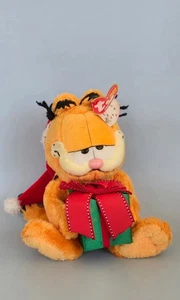 2005 Ty Beanie Baby Happy Holidays 9" Garfield hält Geschenk mit Nikolausmütze - Bild 1 von 5