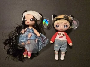 Na Na Na Surprise Puppe 2 Stück Serie 1 Streifen und Serie 4 Juli Joyful  - Bild 1 von 4