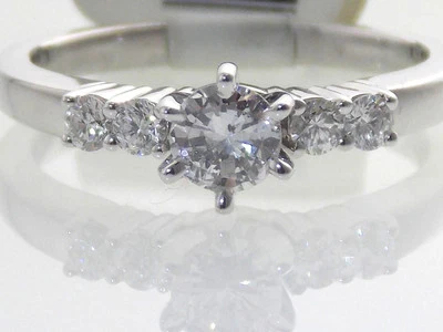 18KT WHITE GOLD MODERN 5/8CTW DIAMOND ENGAGEMENT RING W/TIFFANY SETTING CENTER - Image 1 of 4