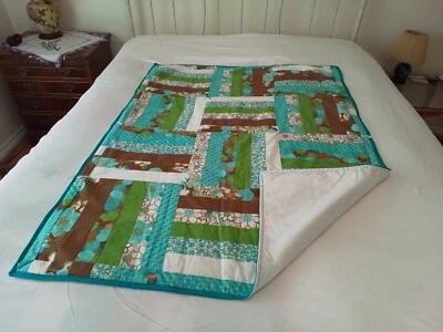 New Handmade Quilt 38" x 50" Turquoise/ light Browns Tied,  Reminds me of Hawaii - Image 1 of 4