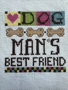 "DOG MAN'S BEST FRIEND" Finished Cross Stitch Hand Stitched, Dog Bones, Home Dec - Picture 1 of 2