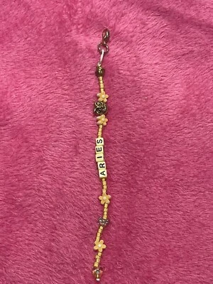 Llavero hecho a mano con cuentas de cristal ARIES signo zodiacal amarillo Foto 1 de 4