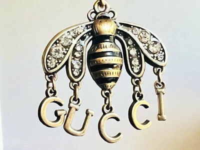 Colgante Gucci logo GG 🖤 abejas bronce Foto 1 de 4