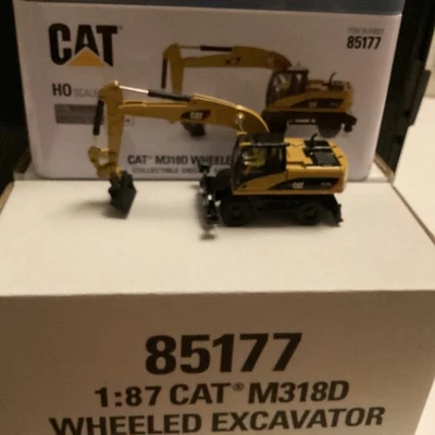 DIECAST MASTERS REF No85177 CATERPILLAR  M318D WHEELED EXCAVATOR 1.87 & HO Scale - Image 1 of 4