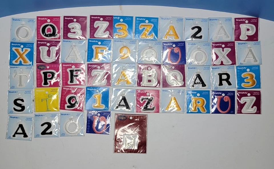 Variety Lot Of Simplicity & Wrights 35mm Letters And Number Applique Patches. - Image 1 of 4