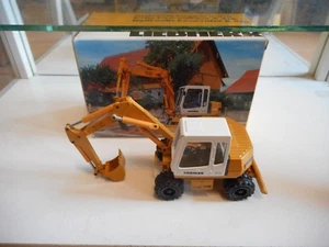 Conrad Liebherr A 310 Hydraulic Excavator in yellow on 1:50 in Box - Picture 1 of 2