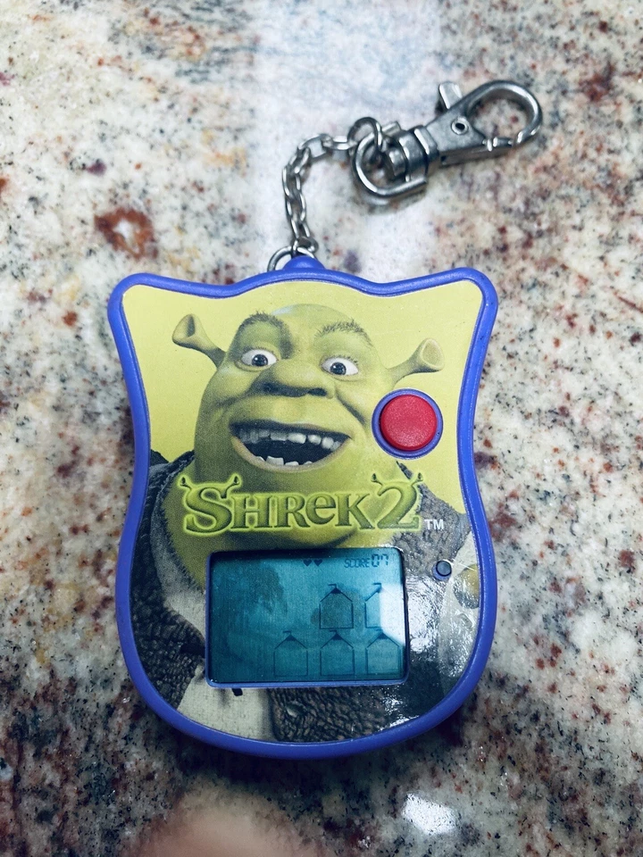 SHREK 2 2004 Electrónico Portátil LCD Llavero Videojuego Techno Fuente Bl Foto 1 de 4