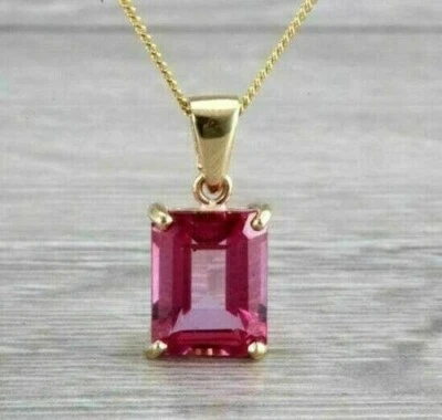 Colgante solitario de zafiro rosa simulado corte esmeralda de 2 quilates enchapado en oro amarillo de 14 k Foto 1 de 4