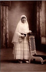 PRETTY GIRL WEARING WHITE COMMUNION DRESS :HOLDING RELIGIOUS BOOK : FRANCE  RPPC - Picture 1 of 3