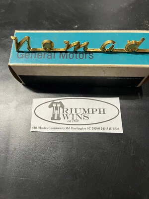 1955-56 Chevy Gold  Plated Nomad Tailgate Emblem NOS - Image 1 of 4