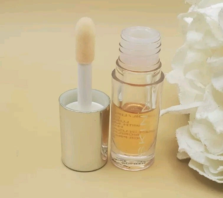 Aceite labial luminoso Skinn Divine Elixir dorado 0,17 oz nuevo sin sello  Foto 1 de 4