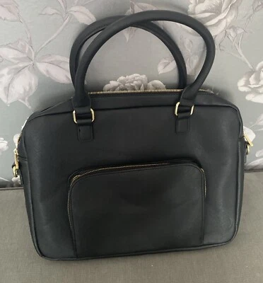 Bolso de mano Stackers negro liso para computadora portátil sin correa para el hombro Foto 1 de 4