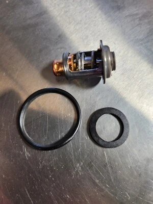 Evinrude 5005440 thermostat etec johnson omc outboard 143° SST W o-ring and seal - Image 1 of 4