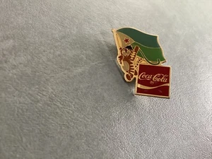 Djibouti 1988 Summer Olympic Games Coca-Cola Hodori Tiger Flag Pin-NEW - Picture 1 of 2