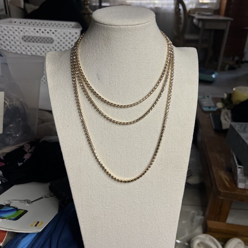 VETEMENTS Collana Guess triplo filo tono oro con cristalli di strass