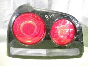 NISSAN SKYLINE LEFT TAILLIGHT R34 4DR SEDAN 12/96-2001 96 97 98 99 00 01 - Picture 1 of 1