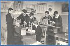Schoolchildren in a class at a chemistry lesson, 1950s Vintage photo
