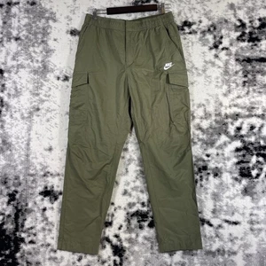 Pantalones cargo Nike Sportswear tejidos sin forro utilitarios para hombre talla grande verde nailon - Imagen 1 de 12