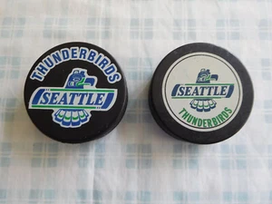 Lot of (2) Seattle Thunderbirds Hockey Puck In Glass Co - Picture 1 of 2