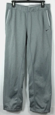 Pantalones deportivos Nike M pierna recta Dri-Fit gris elástico polar cordón tobillo Foto 1 de 4