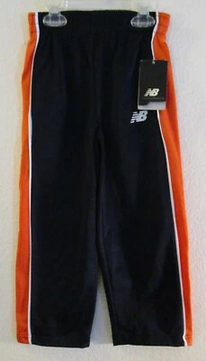 Pantalones deportivos de calentamiento New Balance 4 azul marino/naranja nuevos con etiquetas precio de venta sugerido por el fabricante 34 USD Foto 1 de 2