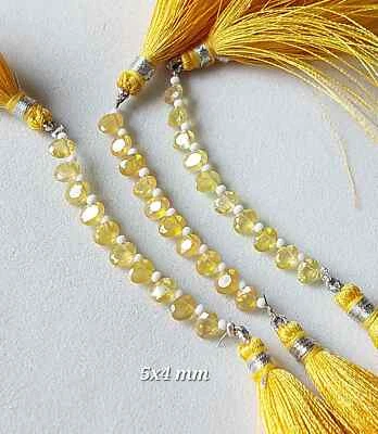 Briolette ovalado facetado perforado lateral de zafiro amarillo natural 4x5-6x8 mm RJS-461 Foto 1 de 4