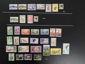 Comore piccolo lotto di VF MNH + incernierati + francobolli usati 2020 cv$72,70 (k250) - Foto 1 di 4