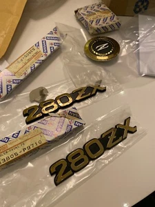 NEW Original Datsun 280ZX by Nissan Gold plastic (Three) emblems, OEM NOS - Picture 1 of 2