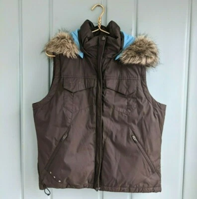 Columbia Mujer Grande Plumón Chaleco Extraíble Capucha Imitación Piel Marrón Invierno Bolsillos con Cremallera Foto 1 de 4