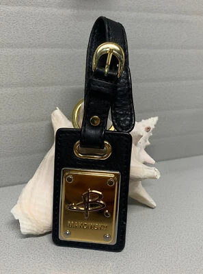 Dije etiqueta colgante B. Makowsky logotipo negro dorado  Foto 1 de 4