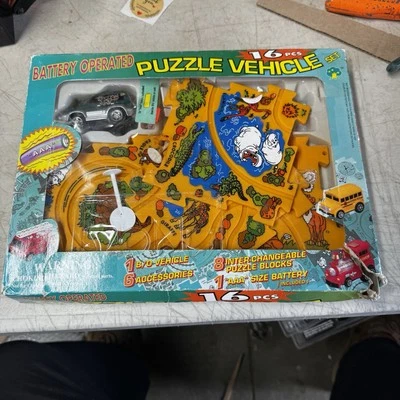 VINTAGE BATTERY OPERATED Rino 16 PCs  Puzzle Vehicle B/O. Puzzle Truck Play Set - Image 1 of 4