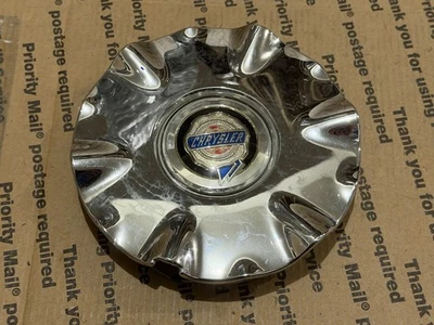 04782269AC 2001-2003 Chrysler Sebring OEM tapa central cromada - 1 Foto 1 de 3