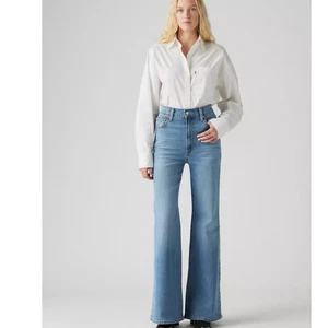Pantalones de mezclilla para mujer Levi's Premium Ribcage Bell en lavado medio ligero muy bonito talla 32 nuevos con etiquetas - Imagen 1 de 14