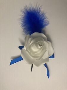 White Rose Button Hole With Royal Blue Feather And Ribbon