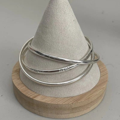 Pulseras brazalete GUESS Silvertone 3 entrelazadas Foto 1 de 4