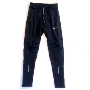 Herren Nike Dri-FIT Schwarz Kompression Laufhose Spandex Tights Gr. M Reißverschluss Knöchel - Bild 1 von 21