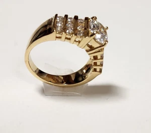 Lady Women's Yellow Gold Plated Round Solitaire 17 CZ Ring Channel Set Size 7 - Picture 1 of 12