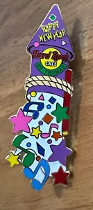Hard Rock Cafe ST. THOMAS 2000 GLÜCKLICHES NEUES JAHR PIN lila Rakete HRC - Bild 1 von 2