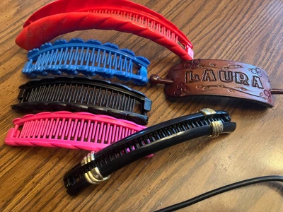 6 hair clips. 5 banana clips. Leather hair piece. Clips 5-7 inches. Plastic e - Image 1 of 4