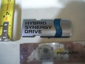 TOYOTA HYBRID SYNERGY DRIVE SILVER BLUE EMBLEM SYMBOL BADGE OEM GENUINE  - Picture 1 of 1