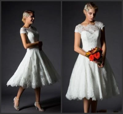 Vestidos de novia cortos blancos vintage de encaje transparente con mangas de gorra de playa Foto 1 de 4