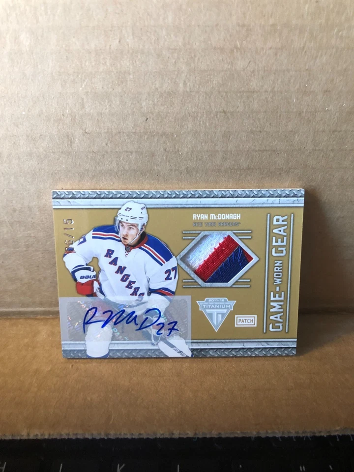 2011-12 Panini Titanium Game Worn Gear Autographs Patch #100 Ryan McDonagh 6/15 - Image 1 of 2