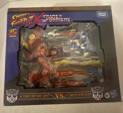 NEW 2022 Takara Tomy 35th Street Fighter II x Transformers Optimus vs Megatron - Image 1 of 4