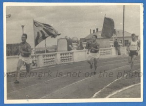Handsome guys in sportswear running around the stadium Gay Int Vintage photo